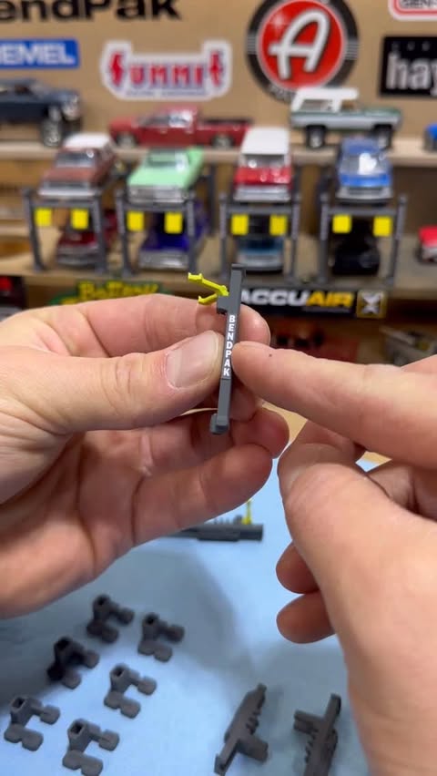 Instagram post by @streettruckdiecast for BendPak. Caption reads: These @bendpak 2 post lifts are on my list to....