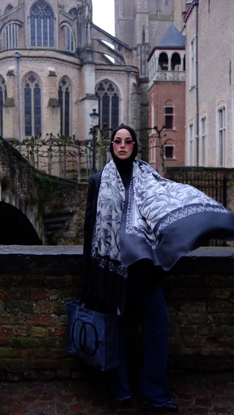 Instagram post by @merve.serapp for Imannoor. Caption reads: Effortless elegance in Brugge 📍
.
@imannoor....