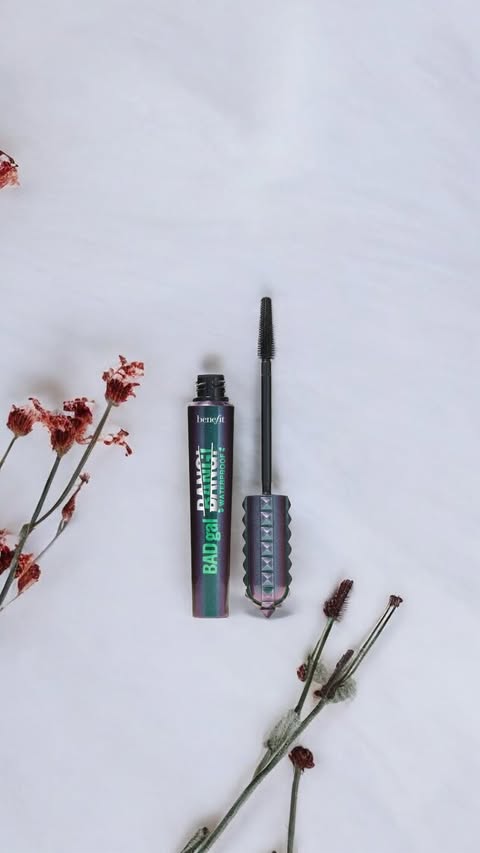 Instagram post by @glowdaily__ for Benefit Cosmetics. Caption reads: [...] formula— BADgal just got badder.....