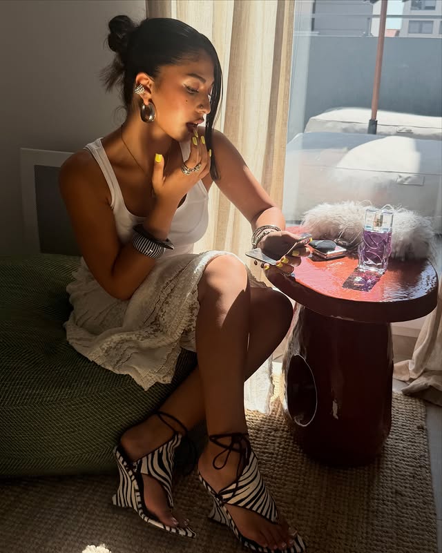 Instagram post by @kianaamn for The Perfume Shop. Caption reads: [...] #EscapeTheOrdinary @theperfumeshop.