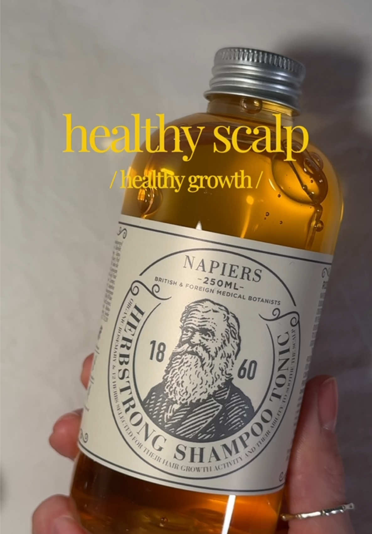 TikTok post by @lana_thegraves for Napiers. Caption reads: [...] growth. 🧴🌿 #HairTok #HairGrowthTips....