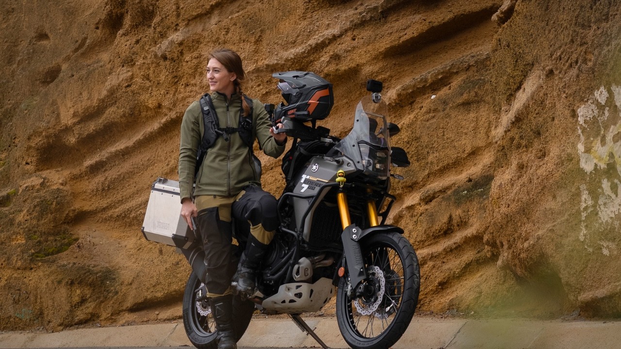 YouTube post by @OffSheGoesADV for Outback Motortek. Caption reads: [...] - ‪@husqvarnamotorcyclesscandi485‬ Outback....