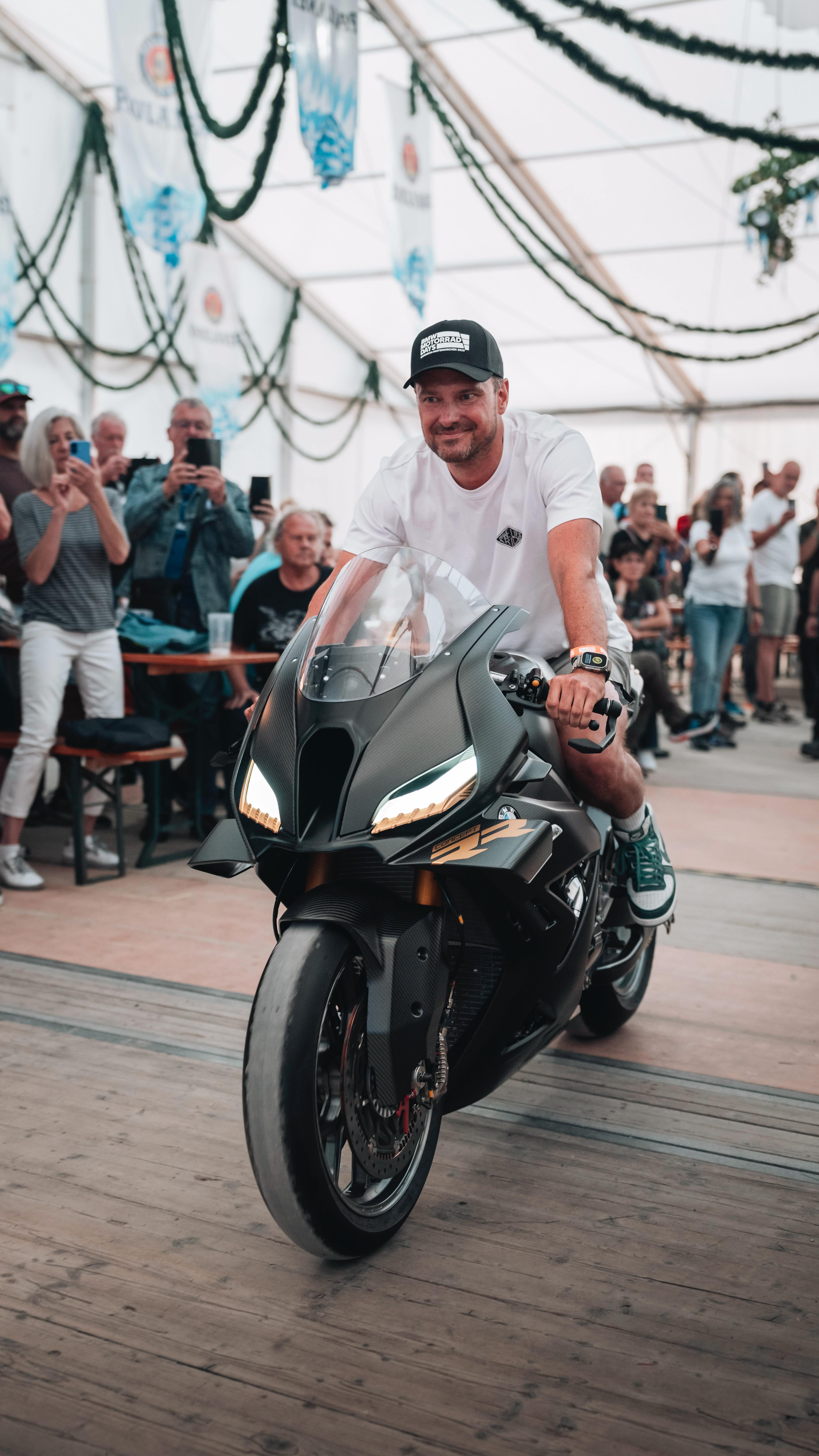 Instagram post by @markusflasch for BMW Motorrad. Caption reads: Garmisch is rumbling — #BMWMotorradDays2025 are....