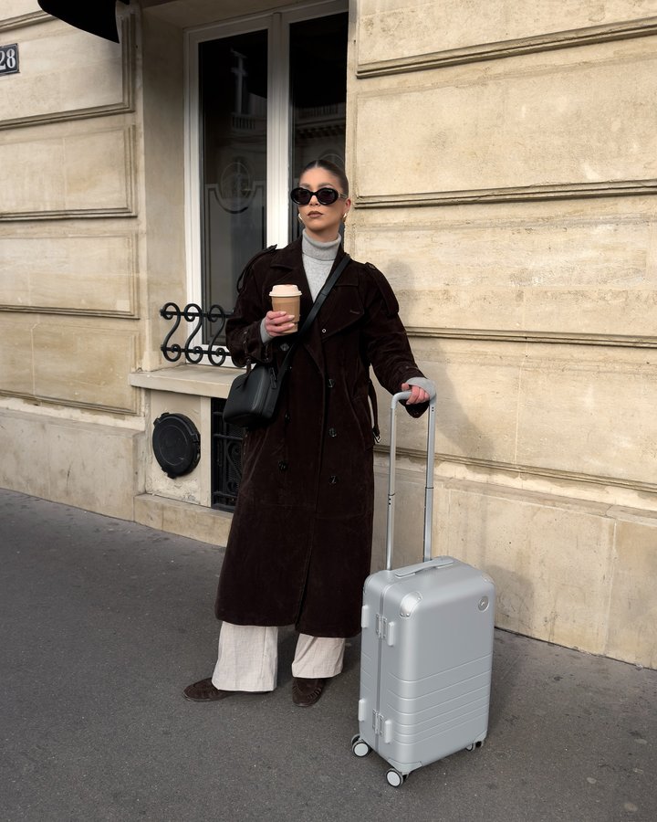 Instagram post by @desislava.iliykova for Monos. Caption reads: Touchdown in Paris with @monostravel 🧳 The Silver....
