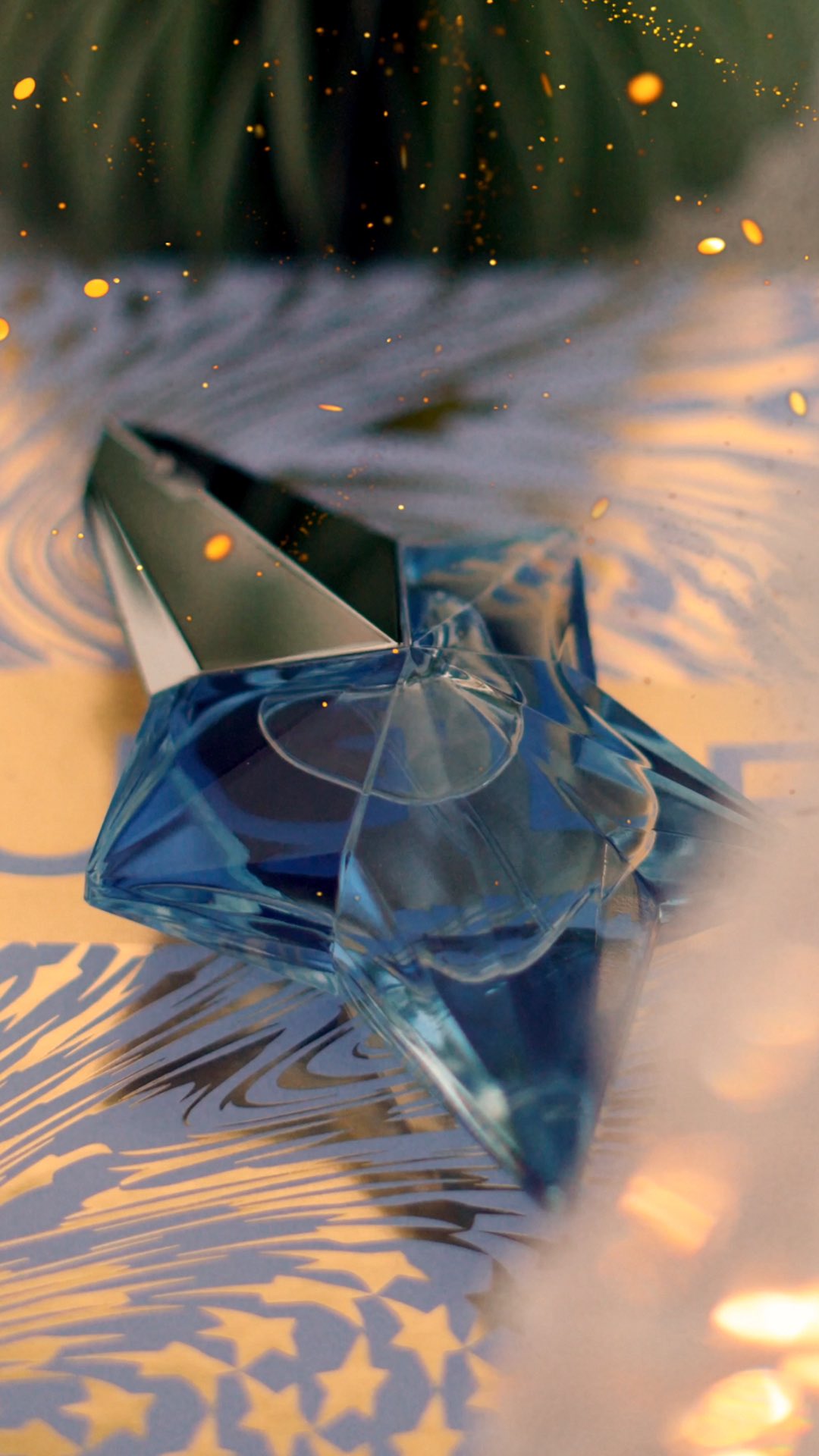 Instagram post by @mossonyi for Mugler. Caption reads: ad✨ Holiday wonder with @muglerofficial 💫 A....