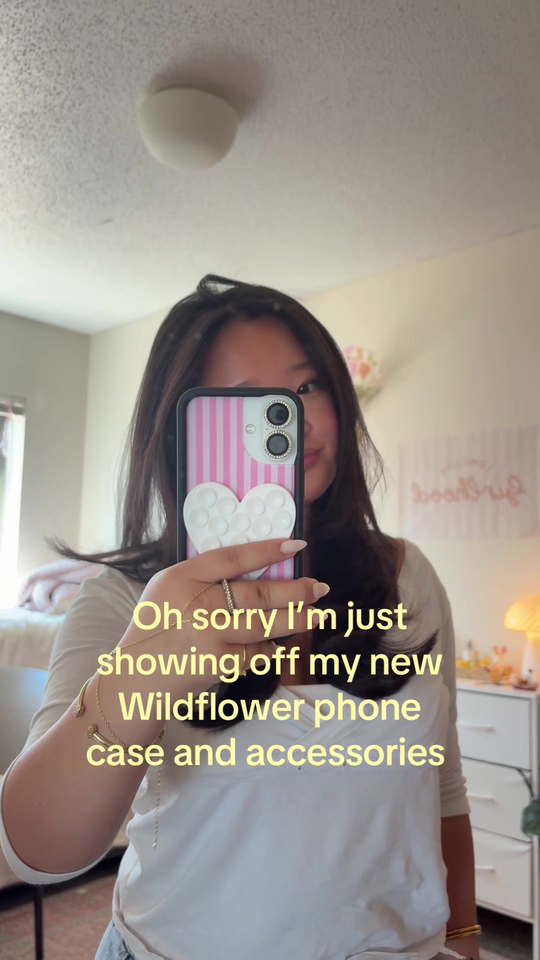 TikTok post by @evevang205 for Wildflower Cases. Caption reads: Sooo in love @Wildflower Cases 🌸🤍....