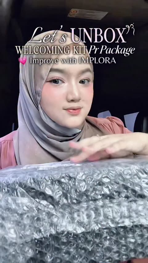 Instagram post by @dwiffahraherz for Implora. Caption reads: unboxing improve with implora welcoming kit PR....