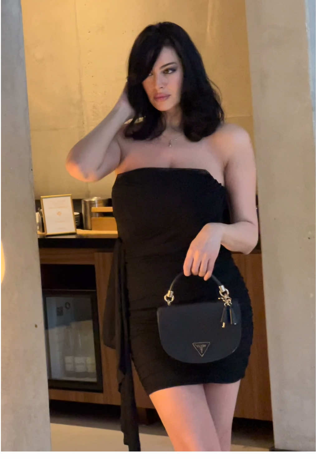 TikTok post by @tatiagaltser for Parthea. Caption reads: Dress from @partheafashion 🖤 guess bag 💼 from....