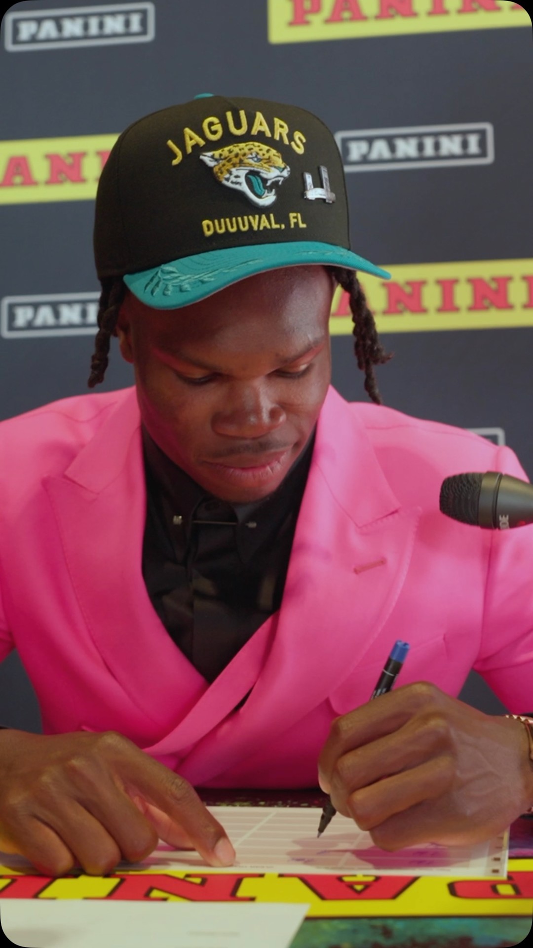 Instagram post by @heykayadams for Panini America. Caption reads: Travis Hunter spent last night looking at houses......