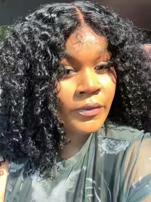 TikTok post by @summadior_ for Menglle Hair. Caption reads: [...] curly wig that looks like my hair!! @MENGLLE....