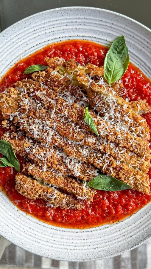 Instagram post by @zenaskitchen for Parmigiano Reggiano. Caption reads: CRISPY AUBERGINE PARMIGIANA! @zenaskitchen

Crispy....