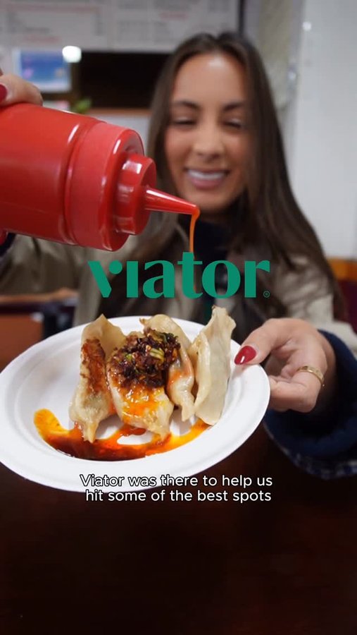 Instagram post by @sistersnacking for Viator. Caption reads: You know we love a food crawl and this one took us....