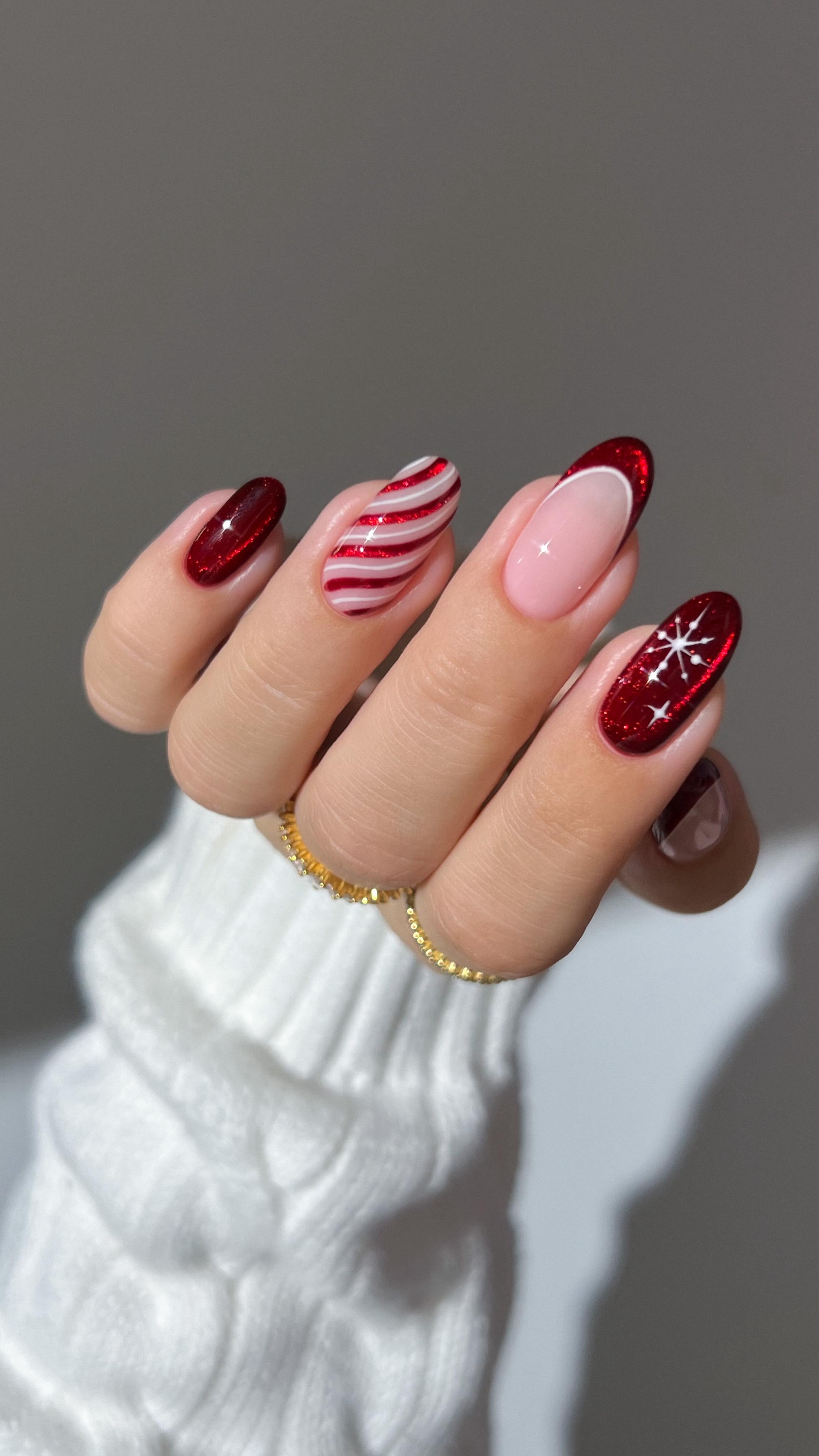 Instagram post by @heygreatnails for BeetlesGelPolish. Caption reads: ♥️🎅🏼🌨️ we’re entering red sparkle territory.......