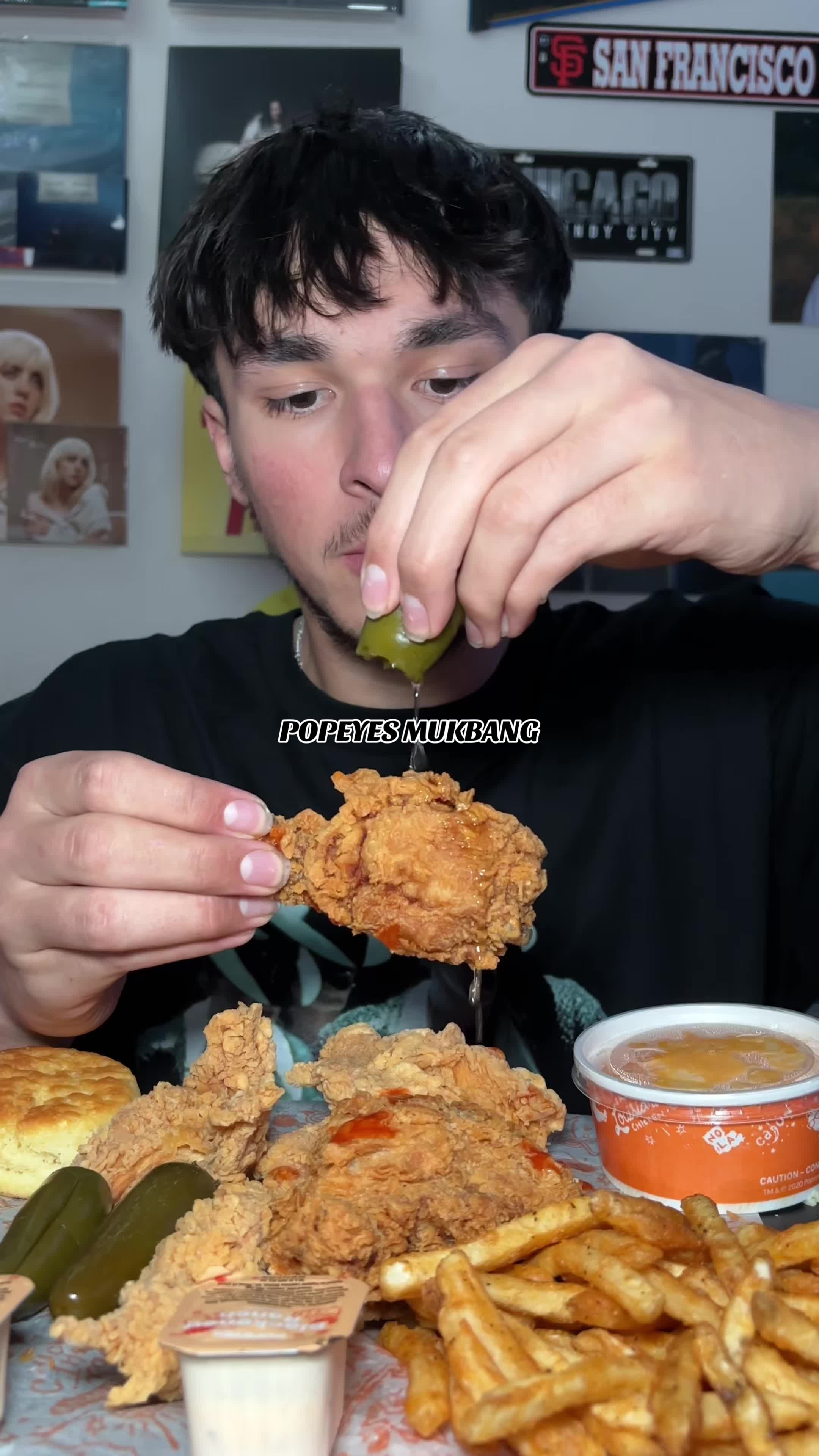 TikTok post by @thefoodiesergio for Popeyes. Caption reads: popeyes mukbang 🍗 the jalapeño juice and hot....