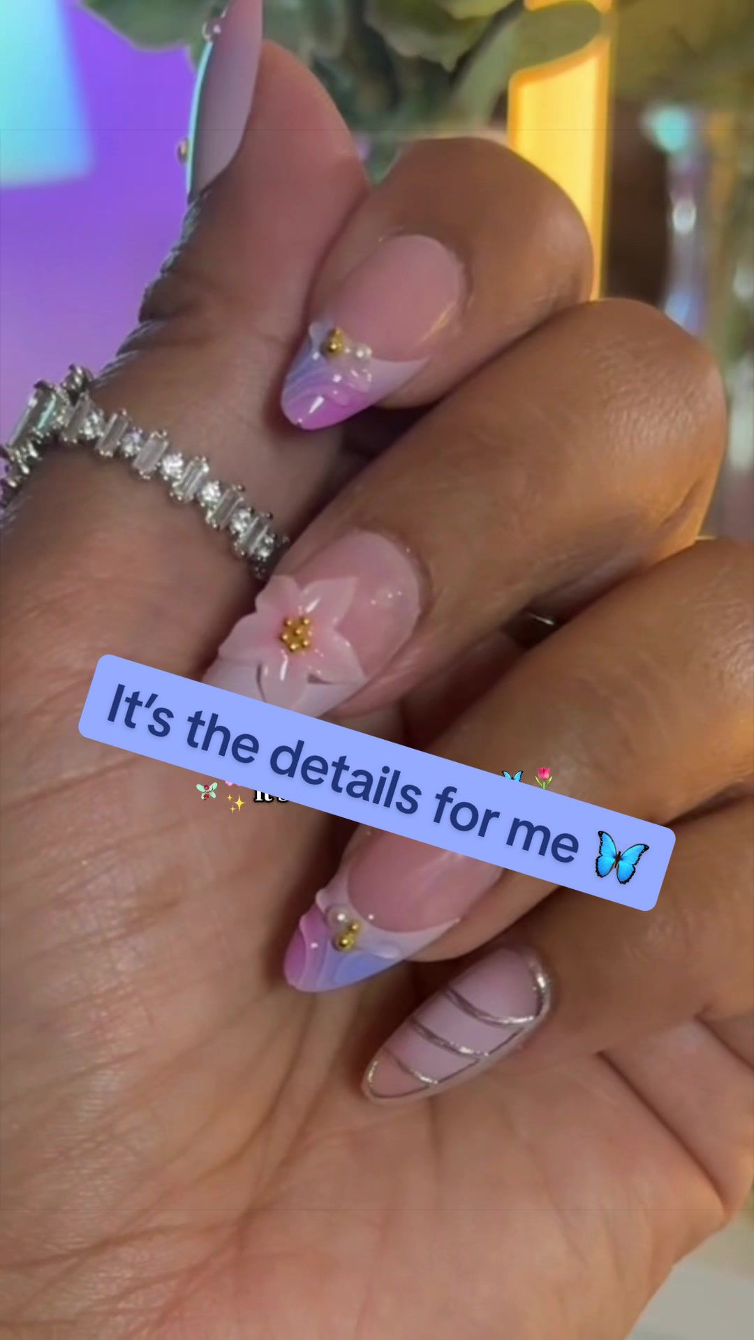 TikTok post by @thatangelavibe for Nailboo. Caption reads: [...] in these nails are top tier! So pretty!....