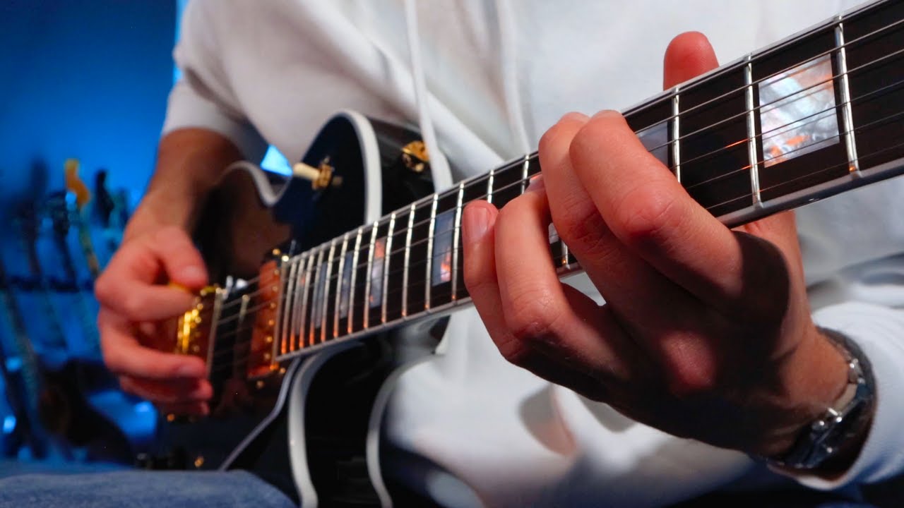 YouTube post by @johnconnearnmusic for Gibson. Caption reads: The 70s Les Paul Returns.