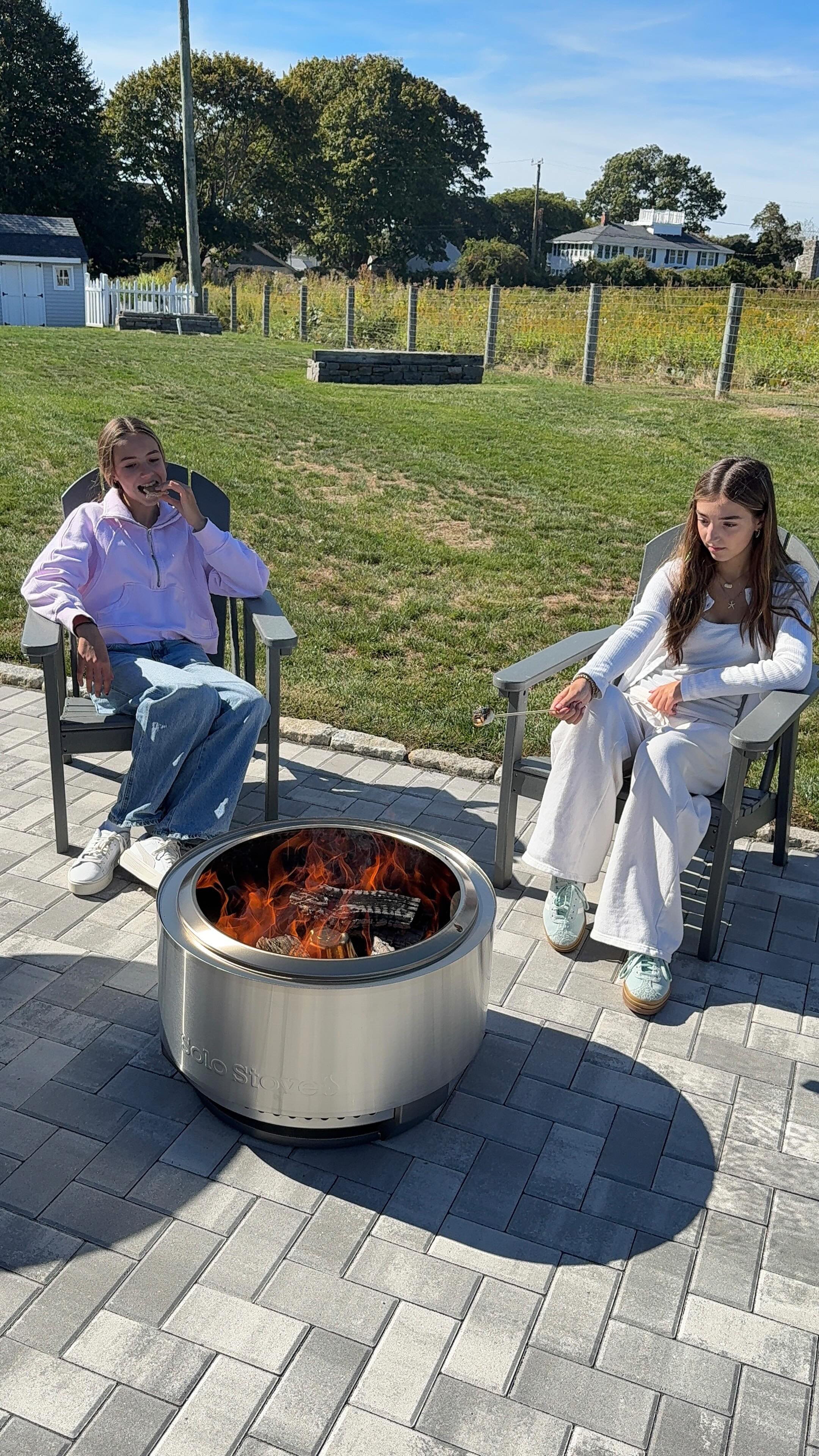 Instagram post by @meganschinella for solostove. Caption reads: Relaxing, recharging, and making memories outside....