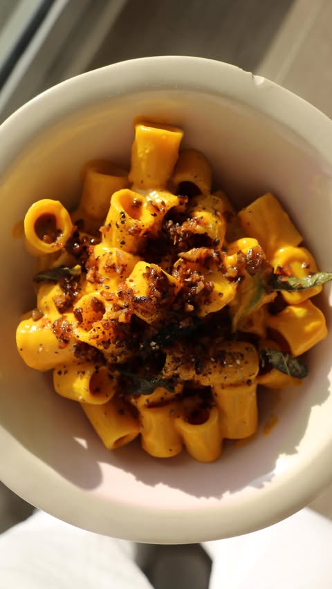 Instagram post by @tishwonders for Merchant Gourmet. Caption reads: This Roasted Red Kuri & Chestnut Pasta combines....