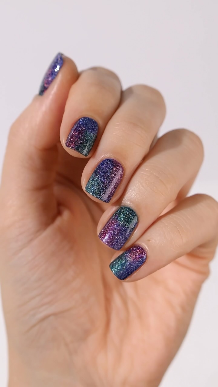Instagram post by @danaturenails for Holo Taco. Caption reads: mystical, magical holo gradient 🔮✨
sponsored by....