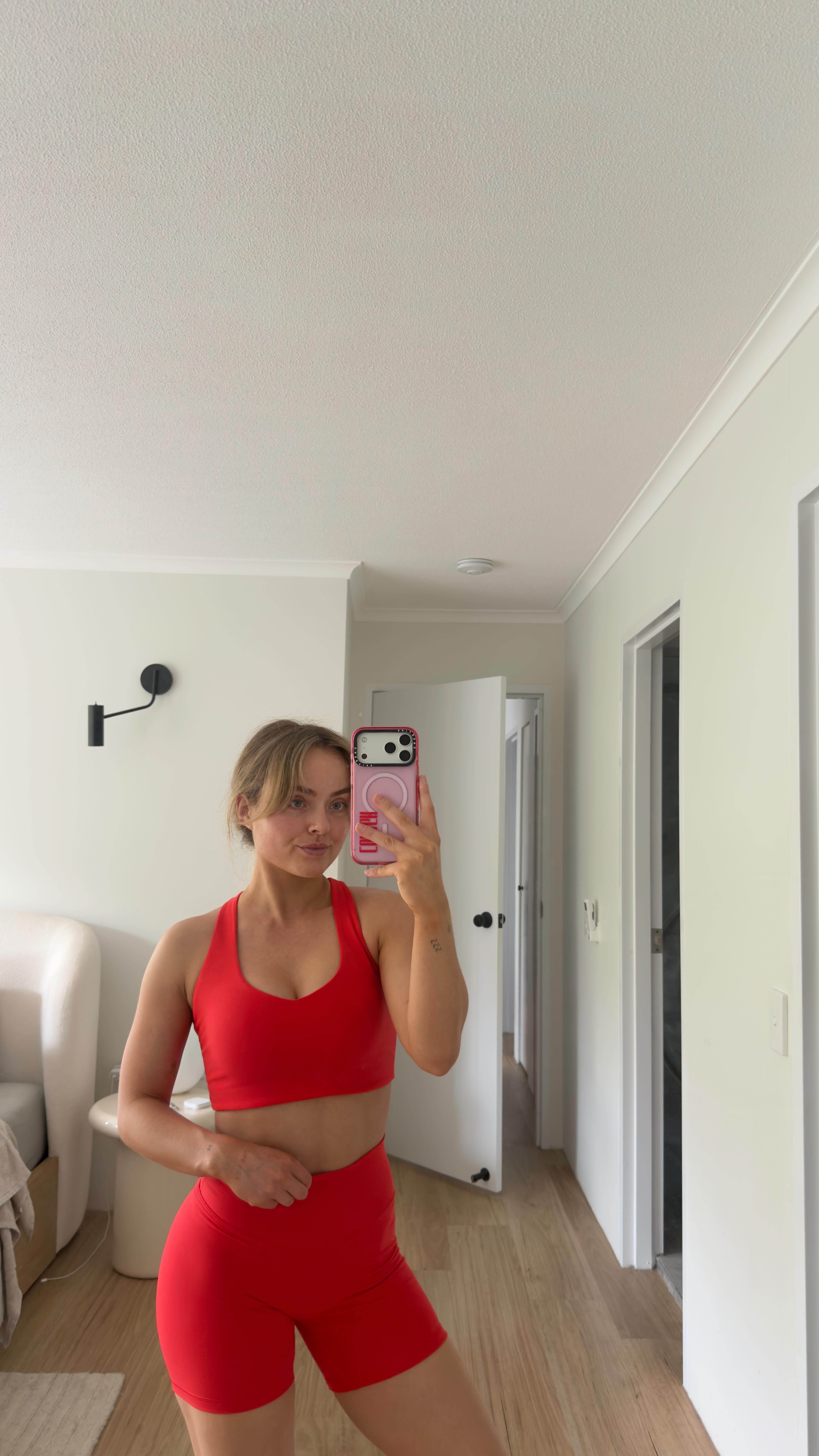 Instagram post by @conagh_kat for Muscle Nation. Caption reads: Let’s unbox some @musclenation pieces while I chat....