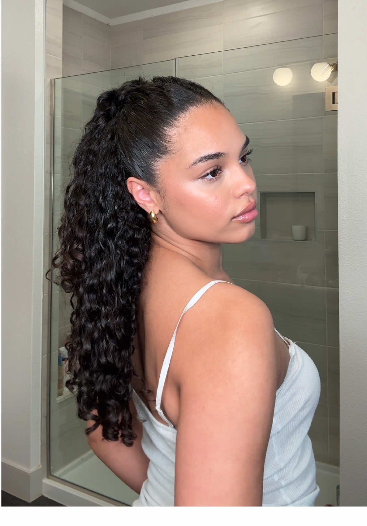 TikTok post by @mariahlovelewis for Emi Jay. Caption reads: Using @Emi Jay 's new Angel Hold Styling Cream to....