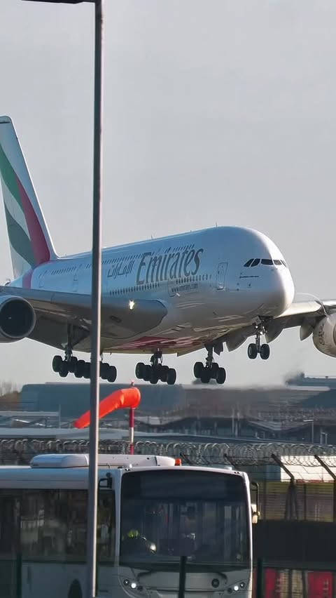 Instagram post by @elemer.aviation for Emirates. Caption reads: Airbus A380 Close-Up Landing at London....