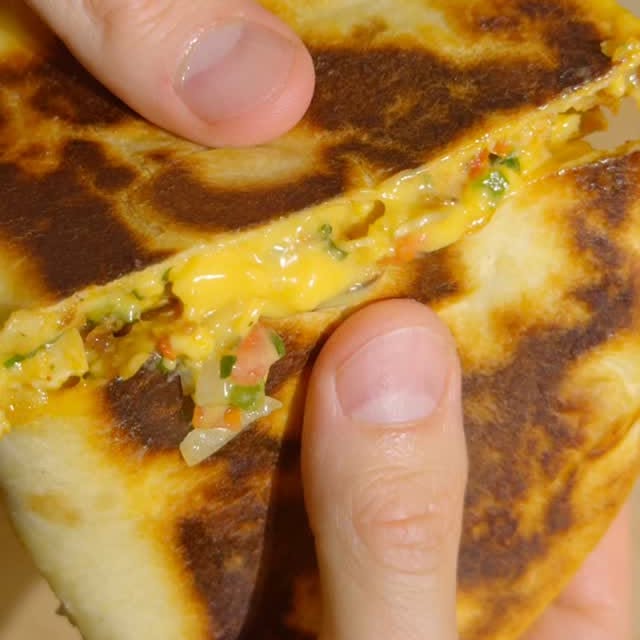 Instagram post by @vegscratchkitchen for Follow Your Heart. Caption reads: #ad This melty, cheesy tofu quesadilla is the....