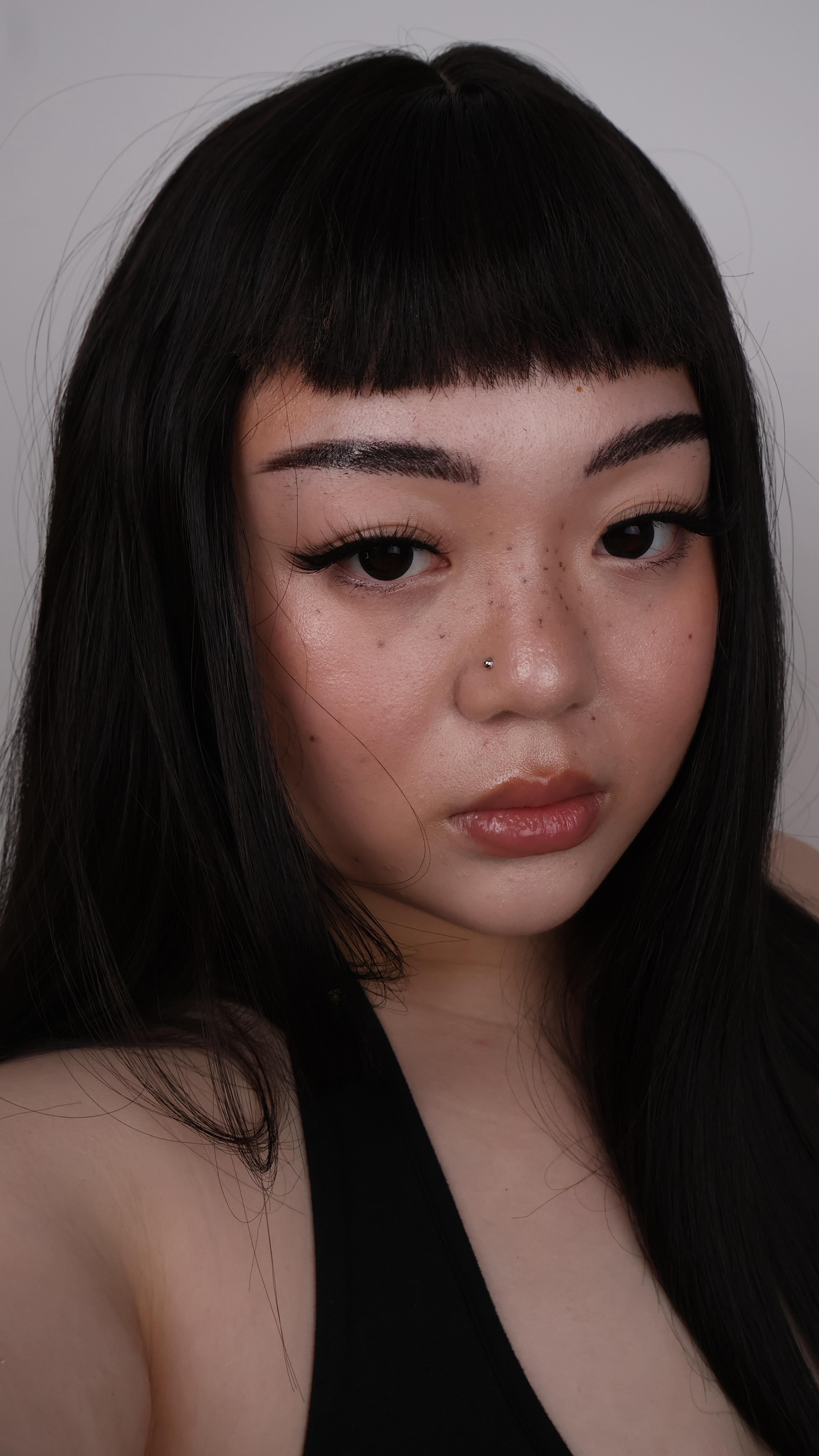 Instagram post by @onmayface for Eylure. Caption reads: makeup inspired by Huda from @loveislandusa....