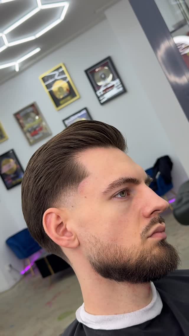 Instagram post by @emfibarber for BaBylissPRO. Caption reads: [...] who’s in charge 💈🫡 

Sponsor @babylisspro....