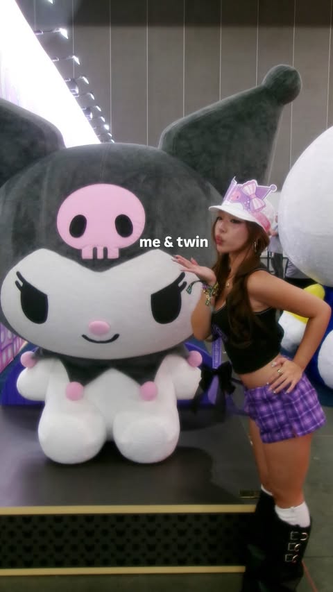Instagram post by @jasminele for Sanrio. Caption reads: [...] time for kcon la this weekend🎀🐈‍⬛💜....