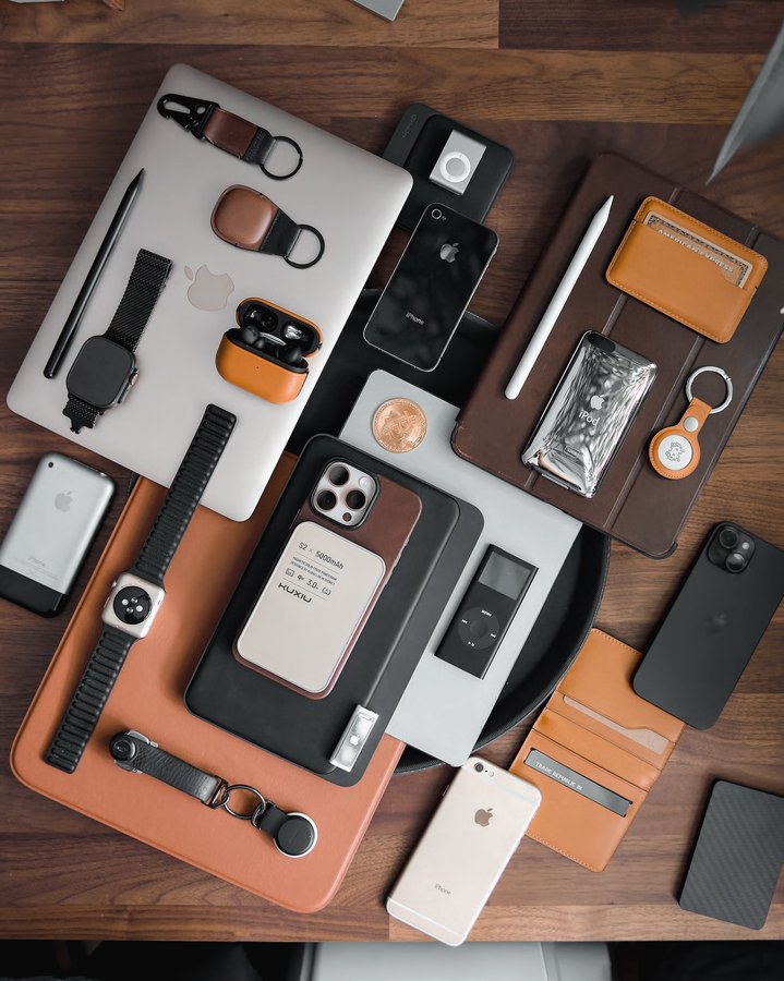 Instagram post by @appleiblog for KUXIU. Caption reads: ad| @KUXIUTECH S2 Power Bank – Natural Titanium....