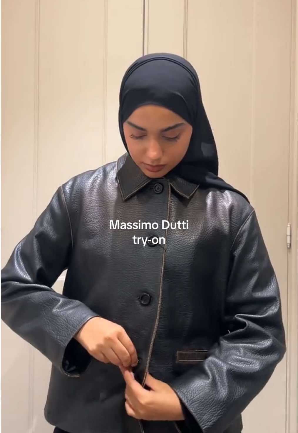 TikTok post by @assiarabian for Massimo Dutti. Caption reads: 🧥try on with me @Massimo Dutti #tryonwithme....