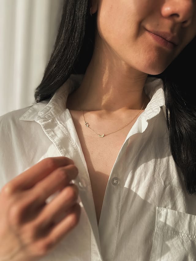 Instagram post by @thelittleloft for Jewlr. Caption reads: [...] 14k solid gold initial necklace from @jewlr....