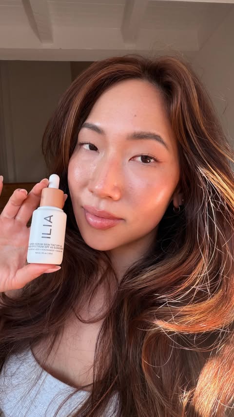 Instagram post by @hanahdewybae for ILIA. Caption reads: Like butter 🧈 wearing the Ilia Serum Skin Tint in....