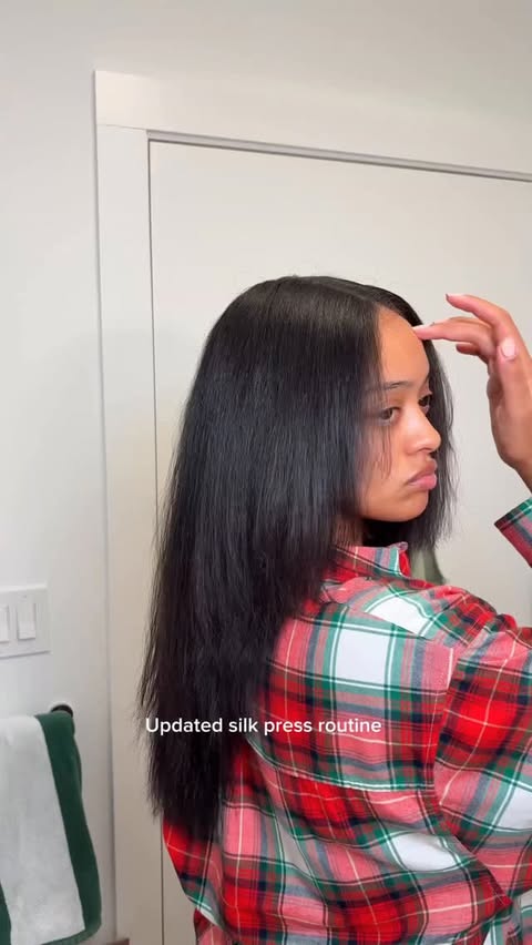 Instagram post by @jasmyndestine for Paul Mitchell. Caption reads: All my essentials for a flawless silk press at....