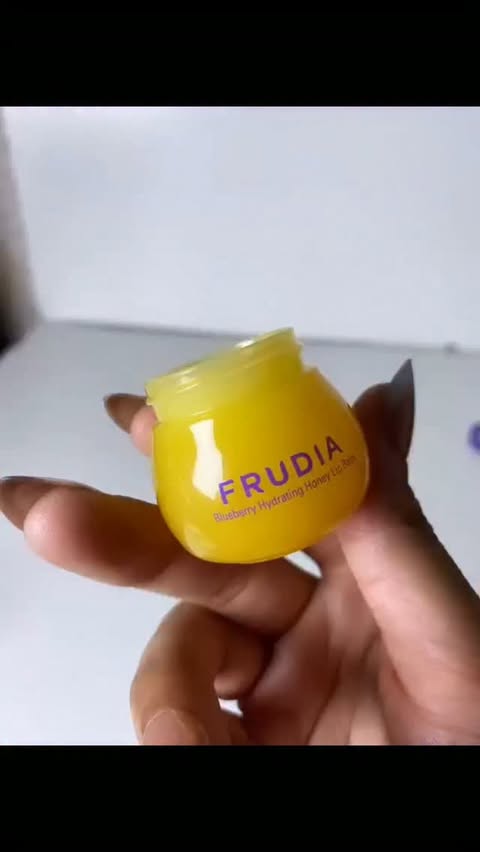 Instagram post by @glow.aizugc for Frudia. Caption reads: Sweet lips, but make it skincare 🍯 Frudia....