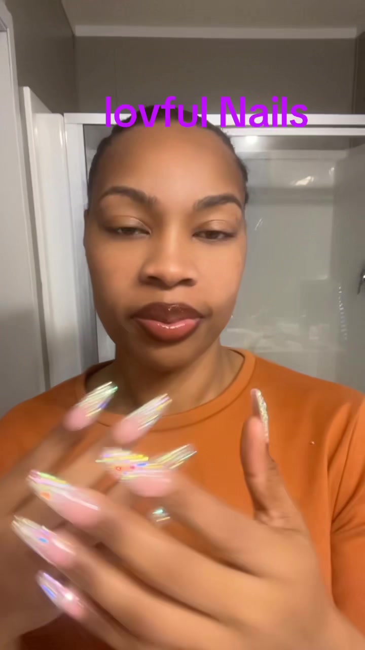 TikTok post by @prettyred750 for LOVFUL. Caption reads: lovful badazzle Nails #pressonnails #badazzle....