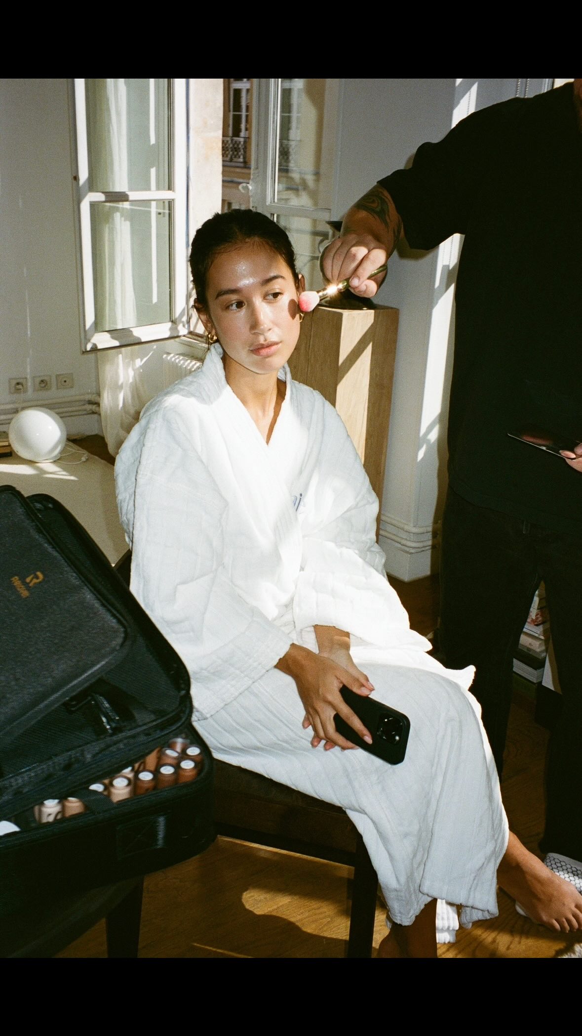 Instagram post by @moya for Saie hello. Caption reads: getting show ready with @saiebeauty for @chloe....