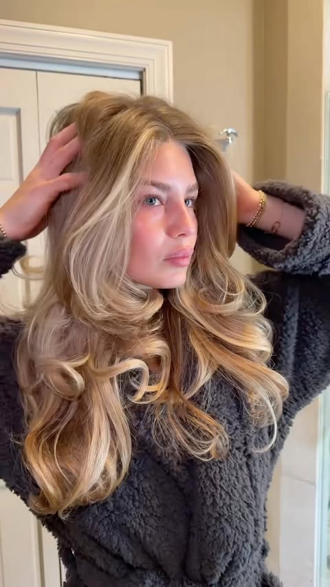 Instagram post by @ava_minaa for OLAPLEX. Caption reads: [...] hair wash day did what it needed to do....