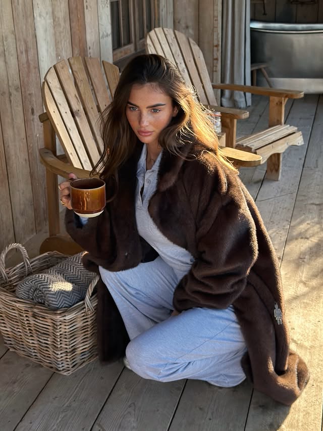 Instagram post by @maddycheary for PrettyLittleThing. Caption reads: cosy cabin days @prettylittlething 🤎.
