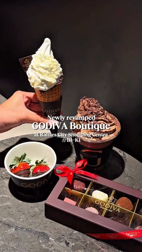 Instagram post by @deeniseglitz for GODIVA. Caption reads: This is GODIVA’s newly reopened boutique at....