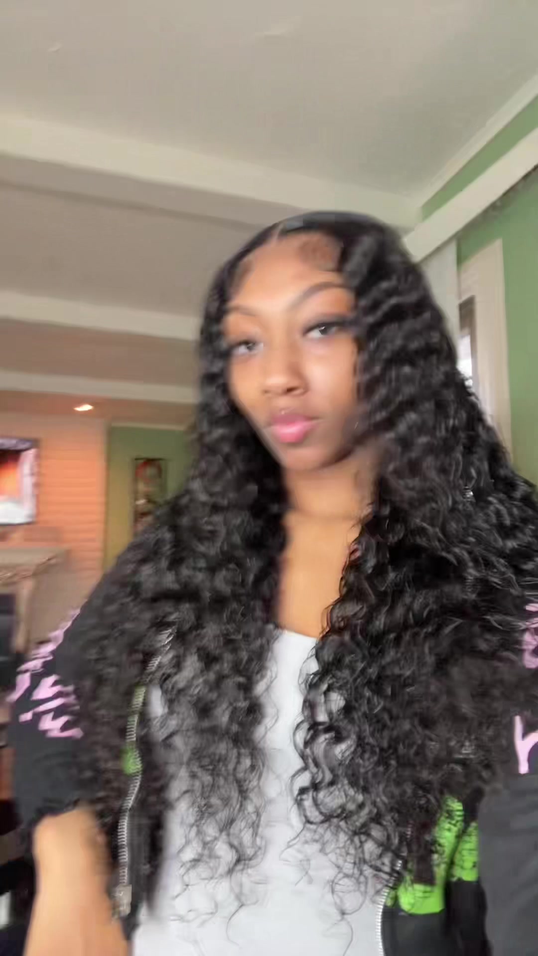 TikTok post by @jasminemarie.k for Curlyme. Caption reads: [...] curly wig is to die for omgg😍😍🔥@CurlyMe....