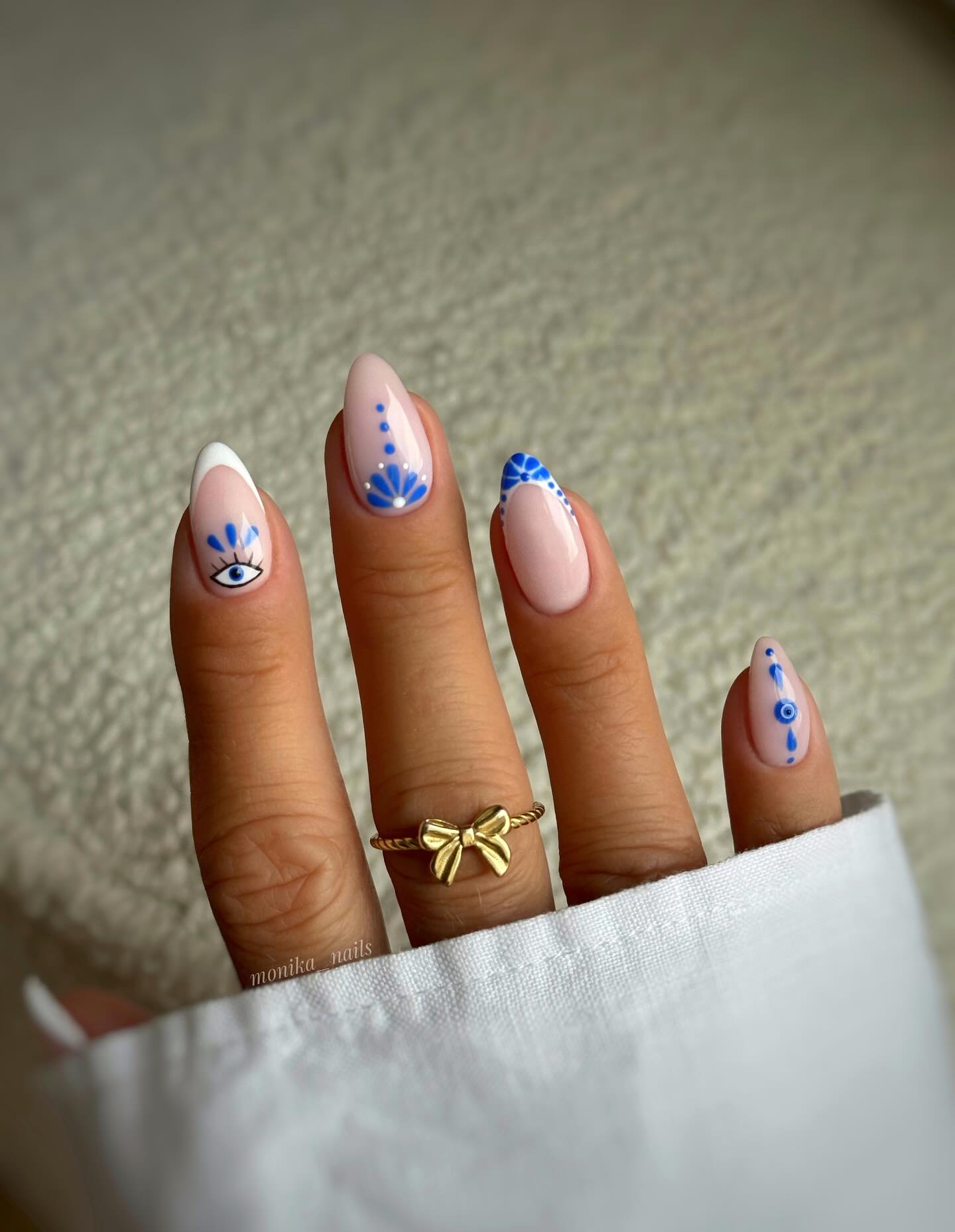 Instagram post by @monika__nails for Lookfantastic. Caption reads: GREEK VIBE 💙🧿💙

AD using @glitterbels....