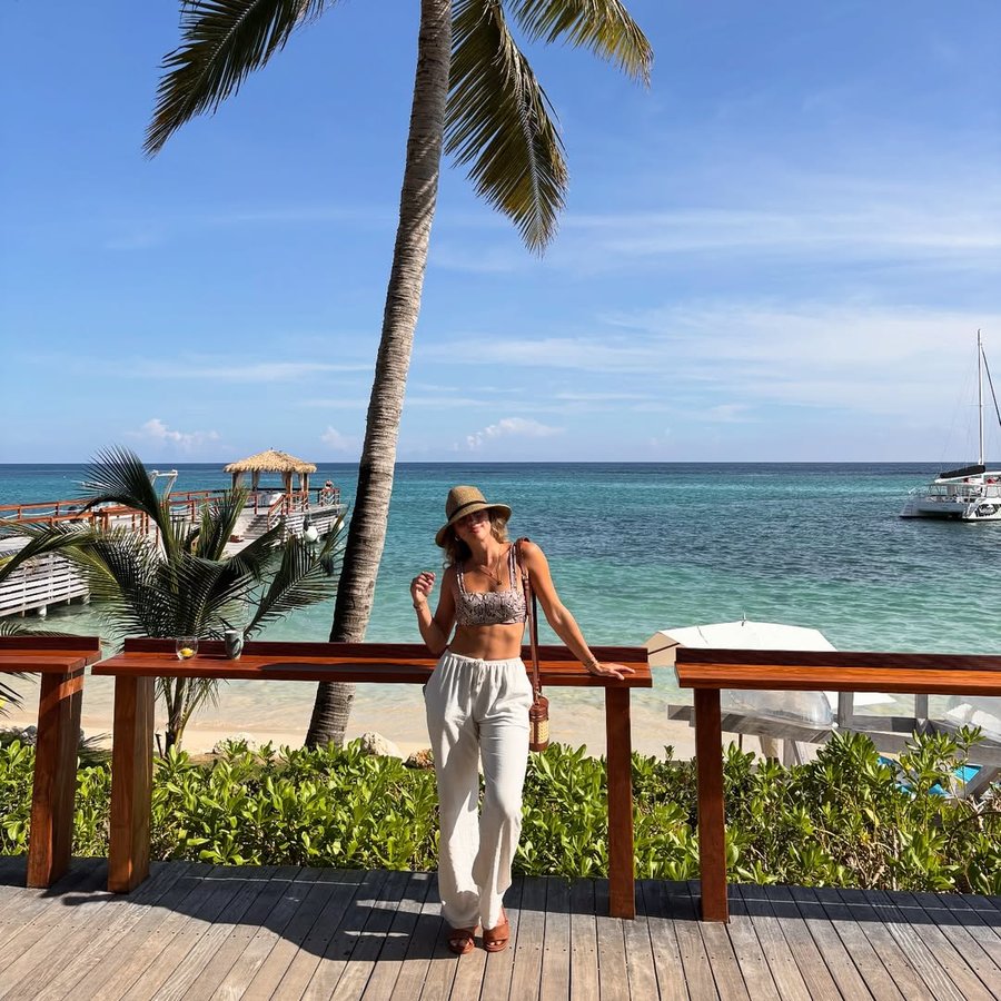 Instagram post by @babybushwhacked for Sandals Resorts. Caption reads: Enjoying being able to explore the world with just....