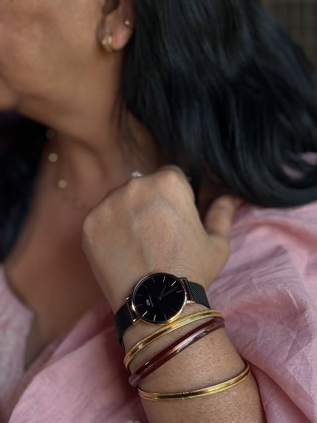 Instagram post by @kaushik____devansh for Daniel Wellington. Caption reads: [...] with a little extra style 😌⌚....