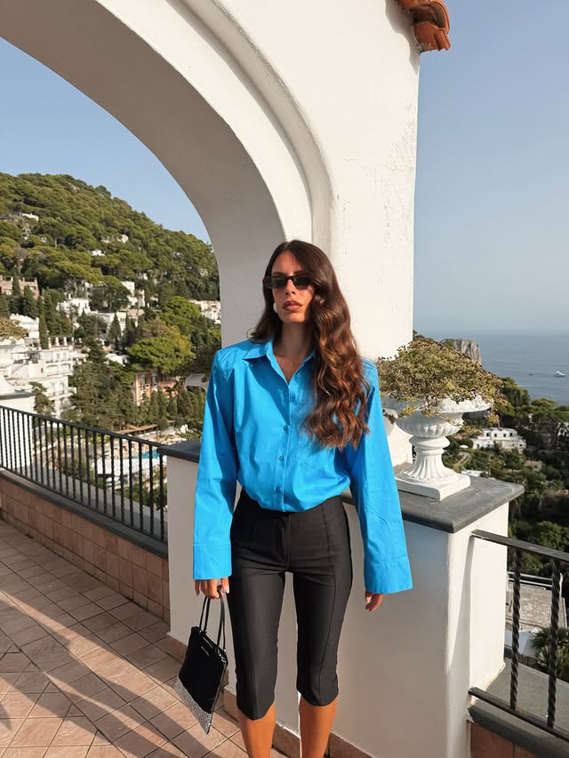 Instagram post by @noemidelp for NA-KD. Caption reads: This view is everything 💙 @nakdfashion has 30%....