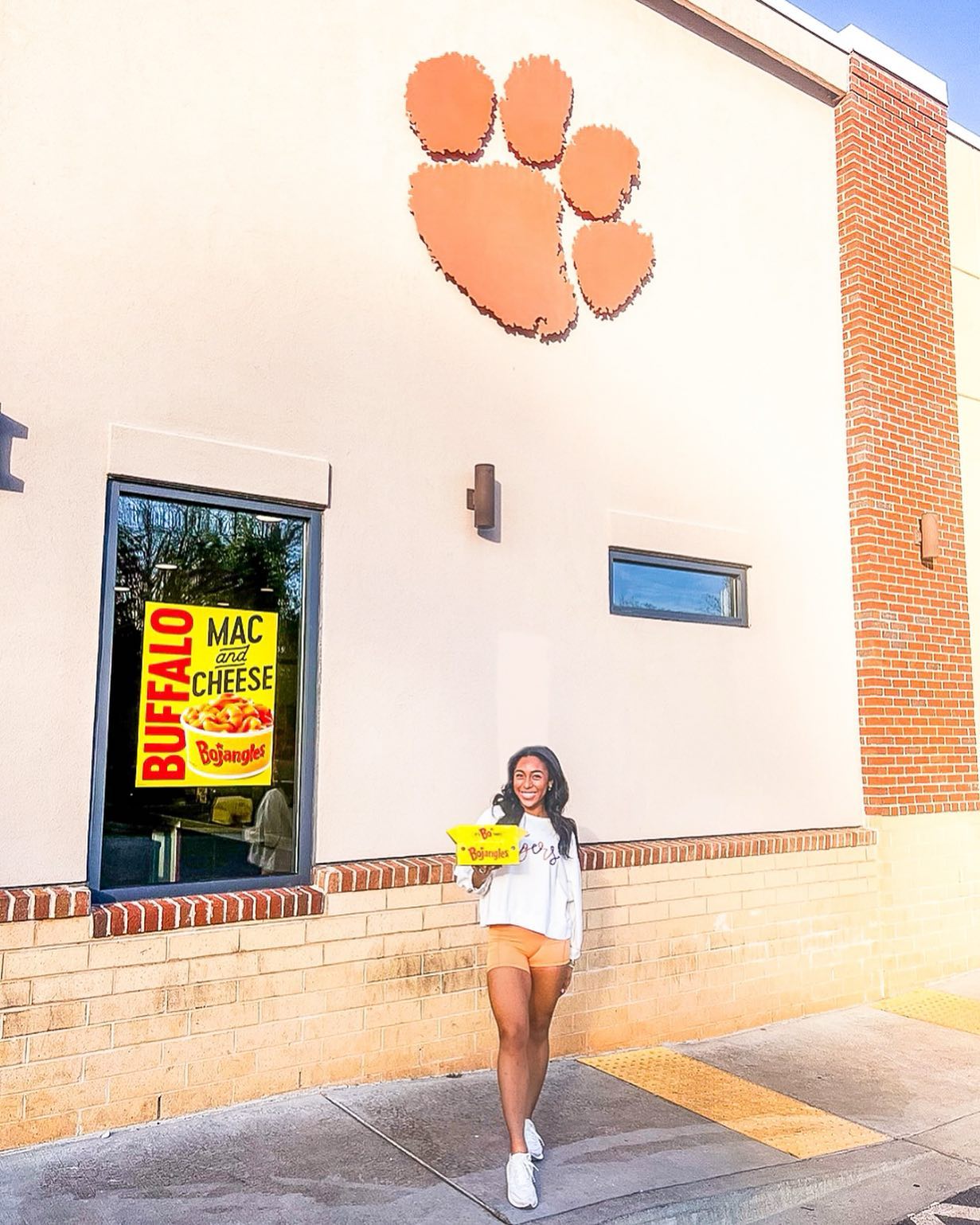 Instagram post by @therealgabbyrose for Bojangles. Caption reads: Get ready, Clemson Tigers fans! The ACC Men’s....