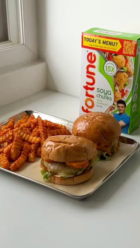 Instagram post by @nids.lid for Fortune Foods. Caption reads: This juicy, cheesy Soya Burger is my hatke twist!....