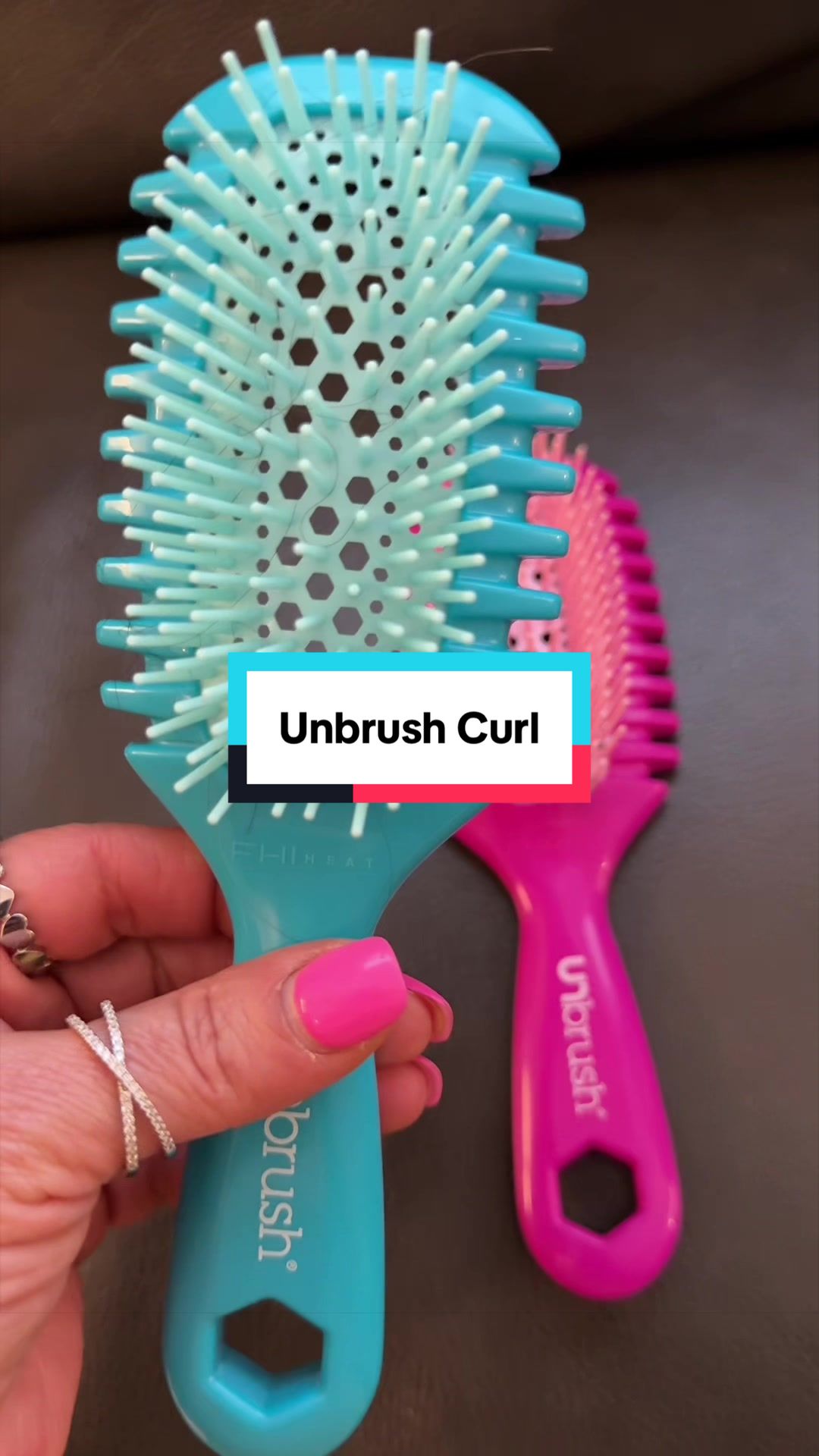 TikTok post by @justmeteresa1 for FHI Heat. Caption reads: @FHI HEAT #unbrushcurl #curlyhair.