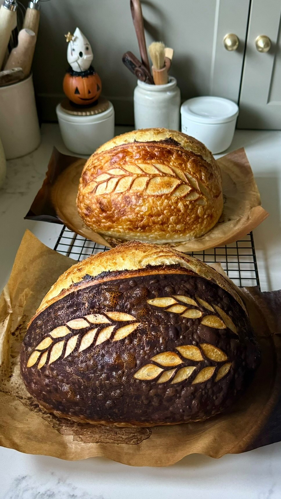 Instagram post by @berg_bakes for Hersheyland. Caption reads: Happy October! 🎃🤎
Love how this sourdough turned....